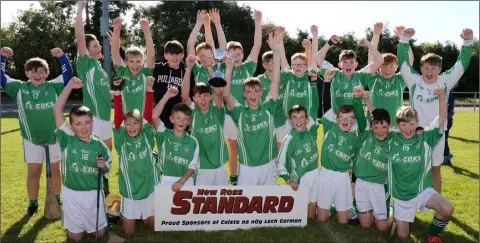  ??  ?? Celebratio­n time for the Cloughbawn boys after their one-point win.