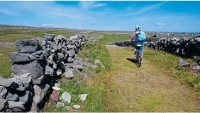  ??  ?? OFF THE BEATEN TRACK: A cyclist on Inishmore on the Aran Islands