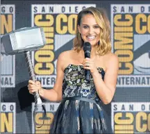  ?? KEVIN WINTER/GETTY ?? Natalie Portman, the new Thor, holds the superhero’s hammer on Saturday at Comic-Con in San Diego.