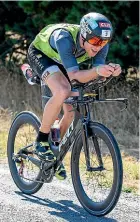  ?? GETTY IMAGES ?? Men’s winner Dougal Allan feels the pain during the cycling.