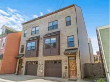  ?? ?? 360 Captures The three-story townhouse at 8 Uxor Way on the South Side is on the market for $449,900.