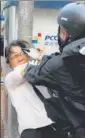  ?? REUTERS ?? A woman (left) scuffles with an anti-government protester at a rally on Saturday.