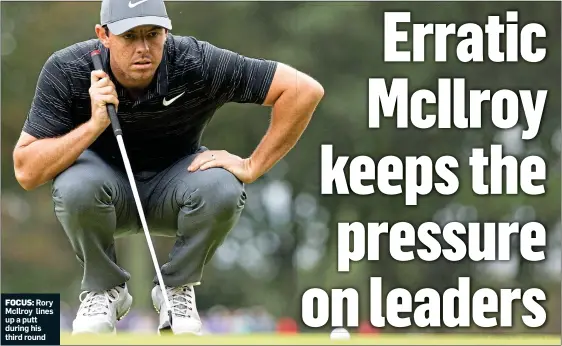  ??  ?? FOCUS: Rory McIlroy lines up a putt during his third round