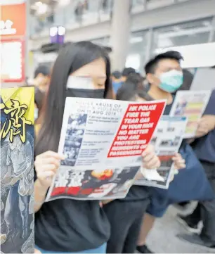  ?? Photo / AP ?? Hong Kong protesters have been wearing patches after a young woman was shot in the face, severely injuring her eye at the weekend.