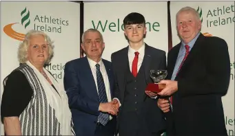  ??  ?? Jack Forde of St. Killian’s A.C. receives the Wexford 2017 Athletics Ireland Juvenile Star Award in the Tullamore Court Hotel from Patsy McGonagle, special guest, Georgina Drumm, Athletics Ireland President, and John McGrath, Chairman, Athletics...