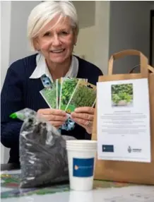  ??  ?? Karen Taylor with one of the herb planting kits being donated to residents at Landmark Square