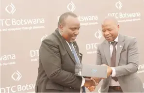  ?? ?? HANDOVER: MD Serumola handing over a drone to Minister Letsholath­ebe