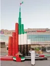  ??  ?? A Burj Khalifa model made with drums in UAE flag colours.