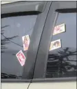  ?? AINUR ROHMAN/JAWA POS ?? ILEGAL: Kartu bergambar cewek seksi beserta nomor teleponnya banyak diselipkan pada kaca mobil di jalanan Ongnyeon-dong, Incheon.