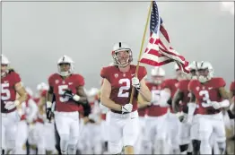  ?? Courtesy photo of Stanford Athletics ?? Hart alum Trenton Irwin leads Stanford out of the tunnel for its game against Washington on Nov. 10 at Stanford Stadium in Palo Alto.