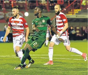  ?? Picture: SNS. ?? Odsonne Edouard fires home Celtic’s fourth goal.