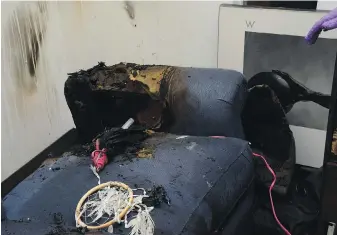  ?? VIA OPCC PUBLIC HEARING ?? A fire-damaged couch in the unit where Lisa Rauch had locked herself inside. A hair straighten­er is visible in the burned part of the couch.