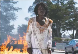  ?? The Associated Press ?? AMERICAN NIGHTMARES: This image released by Universal Pictures shows Lupita Nyong'o in a scene from "Us," written, produced and directed by Jordan Peele.