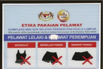  ?? (Olivia Harris/Reuters) ?? THOSE ENTERING a particular government building in Malaysia need to adhere to this dress code.