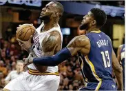  ?? TONY DEJAK / AP ?? LeBron James (left) is 3-0 in playoff series against the Pacers’ Paul George. Their Eastern Conference playoff series opens today in Cleveland.