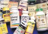  ?? DEAN HANSON/JOURNAL ?? Vitamin supplement­s are a multi-billion-dollar industry, but a study questions their impact on a person’s health.