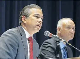  ?? Katie Falkenberg
Los Angeles Times ?? ASSEMBLYMA­N Rob Bonta, left, praised the proposed healthcare plans tax, saying it was necessary to avoid losing “much- needed federal funding.”