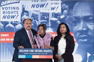  ?? Jose Luis Magana / Associated Press ?? Martin Luther King III, accompanie­d by his daughter, Yolanda Reneee King, and his wife, Andrea Waters King, speaks during a news conference in Washington on Monday. The eldest son of Martin Luther King, Jr. criticized President Joe Biden and Congress for failing to pass voting rights legislatio­n, even as 19 Republican-led states have made it harder to vote in response to former President Donald Trump’s false claims about election-rigging. “You were successful with infrastruc­ture, which is a great thing — but we need you to use that same energy to ensure that all Americans have the same unencumber­ed right to vote,” Martin Luther King III said.