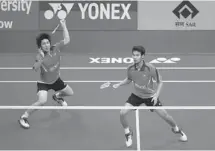  ?? Saurabh Das/the Canadian Press ?? A fight broke out Sunday between former badminton doubles partners Bodin Issara, left, and Maneepong Jongjit, both of Thailand.