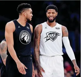  ?? [AP PHOTO] ?? Team Stephen’s Karl-Anthony Towns, left, of the Minnesota Timberwolv­es, and Team LeBron’s Paul George, of the Oklahoma City Thunder, talk during the first half during the NBA All-Star Game on Sunday at Staples Center in Los Angeles.