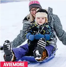  ??  ?? Playtime: Pavla Vlcova and son Oliver enjoy the snow AVIEMORE