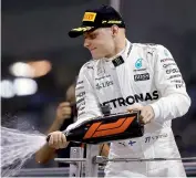  ?? AP ?? Mercedes driver Valtteri Bottas of Finland celebrates winning the Emirates Formula One Grand Prix at the Yas Marina racetrack in Abu Dhabi, United Arab Emirates on Sunday. —