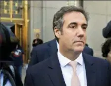  ?? SETH WENIG — THE ASSOCIATED PRESS FILE ?? In this file photo, Michael Cohen leaves federal court in New York City. Criminal investigat­ors are finally getting to study materials seized in raids on the home and office of President Donald Trump’s personal lawyer, Cohen. Their ability to work with...