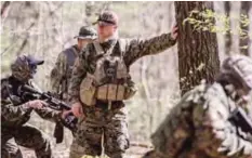  ?? —AP ?? JACKSON, Georgia: Chris Hill stands in the woods during training exercises in the woods on April 1, 2017, with the Georgia Security Force militia.