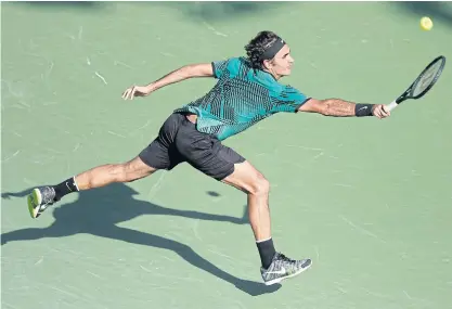  ??  ?? Roger Federer in action against Tomas Berdych during their Miami Open quarter-final.