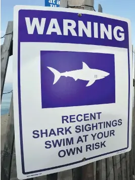  ?? PHOTOS: MERRILY CASSIDY/THE CAPE COD TIMES VIA THE ASSOCIATED PRESS ?? Town officials have closed popular tourist swimming areas around Cape Cod National Shoreline after a man was bitten by a shark on Wednesday.