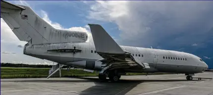  ??  ?? Notorious: Epstein’s Lolita Express sits rusting on a Georgia runway, its engines now removed