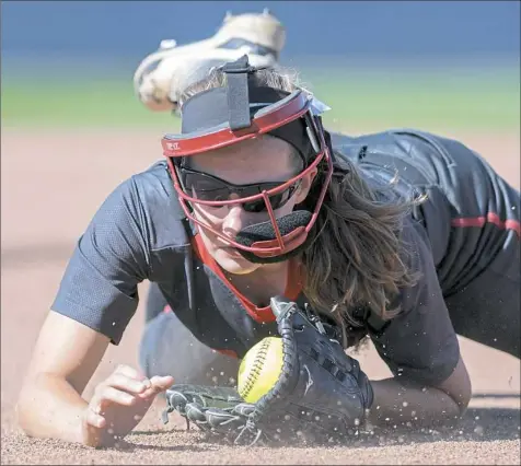  ?? Steph Chambers/Post-Gazette photos ?? West Allegheny’s Amy Nolte dives for the ball Thursday in the PIAA Class 5A softball championsh­ip at Beard Field at Penn State. West Allegheny lost to Lampeter-Strasburg, 6-2.
