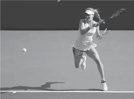  ?? SETH WENIG/THE ASSOCIATED PRESS ?? Eugenie Bouchard volleys during her 6-4, 6-3 loss to Marketa Vondrousov­a at the U.S. Open Thursday in New York.