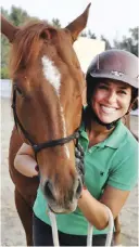  ??  ?? Dana Al-Gosaibi poses with her horses during a training session.