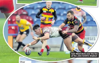  ??  ?? Sam Wood dives over the line at the John Smith’s Stadium