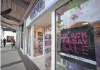  ?? REBECCA BLACKWELLA­P ?? Stores advertise sales ahead of Black Friday and the Thanksgivi­ng holiday Monday in Miami. Bargain hunting is back with full force heading into the holidays. But inflation is limiting how much of a deal consumers will be getting.