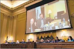  ?? Kent Nishimura Los Angeles Times ?? A VIDEO of the deposition of John Eastman, left, is played during a hearing of the House committee investigat­ing the attack on the Capitol.