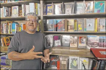  ?? Damian Dovarganes The Associated Press file ?? A collection of essays released Jan. 28 by writer and activist Luis J. Rodriguez, shown at his independen­t bookstore and community center in Los Angeles in 2011, is among the books that Latinos are recommendi­ng through social media.