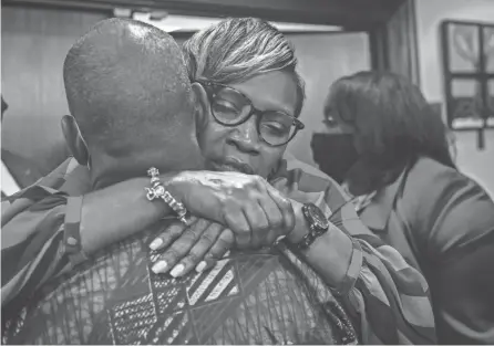  ?? STEPHEN B. MORTON/AP ?? Ahmaud Arbery’s mother, Wanda Cooper-jones, is hugged by a supporter after the jury convicted Travis Mcmichael in the trial of Mcmichael, his father, Greg Mcmichael, and neighbor William “Roddie” Bryan, Wednesday in the Glynn County Courthouse in Brunswick, Ga.