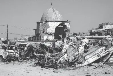  ?? ZAID AL-OBEIDI / AFP / GETTY IMAGES ?? The dome of the destroyed Al-nuri Mosque in the Old City of Mosul, a year after the city was retaken by the Iraqi government forces. The western part of the city is basically eight million tons of rubble, Frank Giustra writes.