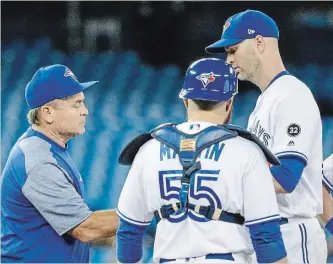  ?? CARLOS OSORIO TORONTO STAR ?? Blue Jays pitcher J.A. Happ, right, was pulled from the game by manager John Gibbons during the fourth inning of MLB action on Thursday against the Seattle Mariners. The Blue Jays 10 quality starts this season is last in the league.