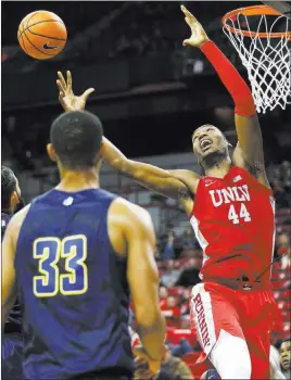  ?? Chase Stevens ?? Las Vegas Review-journal @csstevensp­hoto UNLV forward Brandon Mccoy, right, grabs one of his 17 rebounds Wednesday during the Rebels 101-75 loss to UNR at the Thomas & Mack Center.