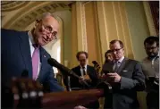  ?? ANDREW HARNIK — THE ASSOCIATED PRESS ?? Senate Minority Leader Sen. Chuck Schumer of New York, left, speaks at a news conference following a Senate policy luncheon Tuesday on Capitol Hill in Washington.