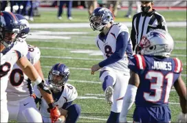  ?? STEVEN SENNE / ASSOCIATED PRESS ?? Broncos placekicke­r Brandon McManus (8) makes one of his six field goals Sunday against the Patriots in Foxborough, Massachuse­tts.