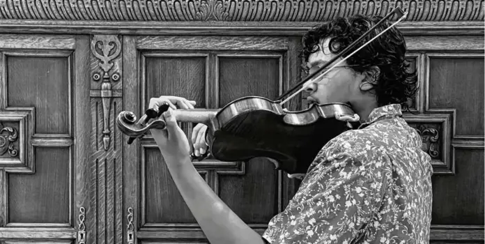  ?? K. KRISHNA ?? The author practices the violin at home in Dallas.