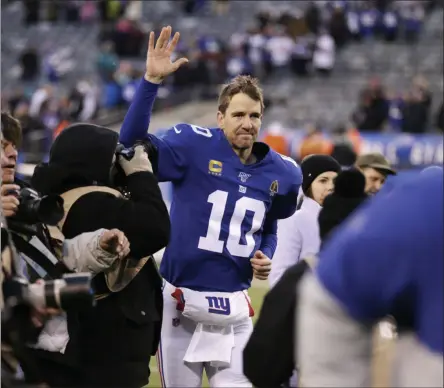  ?? ADAM HUNGER - THE ASSOCIATED PRESS ?? File-This Dec. 15, 2019, file photo shows New York Giants quarterbac­k Eli Manning (10) leaving the field after defeating the Miami Dolphins in an NFL football game, in East Rutherford, N.J.