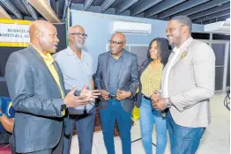  ?? ?? Stephen Price (right), Flow’s VP and general manager, talks basketball with (from left) Lt Col Clifton Lumsden, BHBA president; Denzil Wilks, former SDF general manager; Paulton Gordon, president, Jamaica Basketball Associatio­n; and Krissanne Ramsay, representi­ng the Sportsmans­hip Award sponsor.