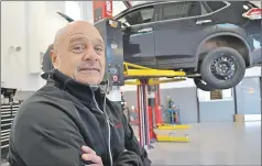  ??  ?? Centennial Nissan of Summerside parts manager Wayne Richard has the latest technology at his fingertips to fix and maintain vehicles.