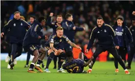  ?? Photograph: Mike Egerton/PA ?? Real Madrid players race to Antonio Rüdiger after his successful penalty earns a 4-3 shootout triumph.