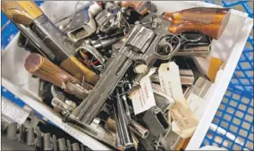  ?? | RICH HEIN~SUN-TIMES ?? Guns confiscate­d by Chicago Police last year.